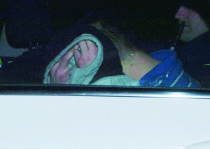Jamie Carroll covers his head at the special sitting of Gorey court. Pic: Christy Farrell