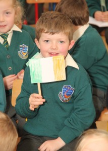 Noah Ó Dughaill is pictured at the 1916 flag presentation in the Wexford Gaelscoil. Pic: Christy Farrell