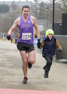 Paul Browne and his son Joe crossing the finishing line at the Hope & Dream 10 Mile on Sunday. Pic: John Walsh