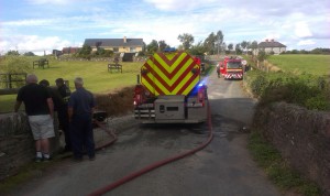 Echo photographer, Christy Farrell, took this shot of fire crews replenishing their supplies at the Slaney near Ballycarney