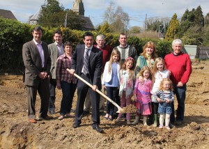 Cllr John Hegarty turning the sod for the new sheltered housing development at Kilanerin.