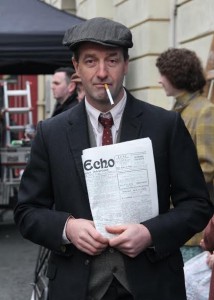Extra Bill Jordan from Kiltealy is pictured with the newspaper of the day on the set of Brooklyn. Pic: Christy Farrell