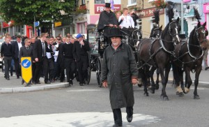 The Connors funeral passes through the roundabout at the Coach House, Gorey, last Friday, on the final journey to St. Michael's Cemetery. Pic: Christy Farrell.