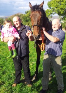 Noel Dempsey, owner, and John Walsh, trainer, with a winner at Tinahely today that is named after the little girl in the picture, Lule Kyle.