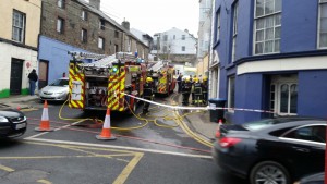 Five people rescued from burning building at Enniscorthy .