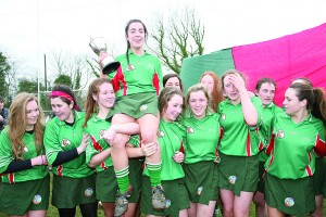 Caption Catriona O'Brien is carried shoulder high as the celebrations begin after Gorey Community School's All Ireland camogie title success. Pic: John Walsh.