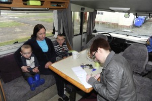 Sarah Keogh with her children Ryan and Paddy speaking to Wexford Echo reporter Anna Hayes in the camper van. Pic: Jim Campbell