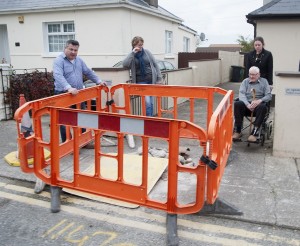 No access for a wheelchair. Cllr George Lawlor with members of Carley family in Davitt Road as the water meter installers blocked the entrance to their home. Pic: Jim Campbell