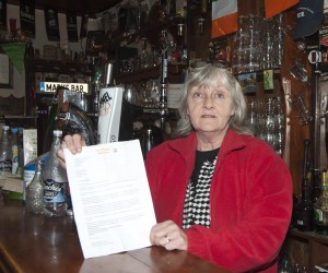 Catherine Kielty Dempsey from Mary's Bar pictured with the letter she received. Pic: Jim Campbell