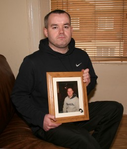 Paul Fenlon holding a photo of his brother Nicholas. Pic: John Walsh