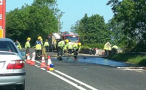 Firemen clean up following a single vehicle accident involving a lorry. Pic: Sharon Fox