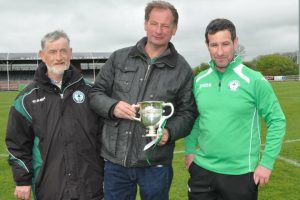 Peter "Puck" Quinn (centre) pictured with managers Nicky Murphy Snr and Jr after Shamrock Rovers' cup win last year. Pic: Sarah Murphy