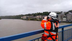 Member of the Coast Guard on watch on O'Hanrahan Bridge in New Ross after a young man fell into the river. Pic: Jim Campbell